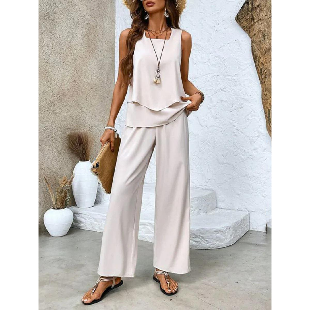 Dione Damesæt – Elegant Ærmeløst Sæt med Lagdelt Top og Brede Bukser.